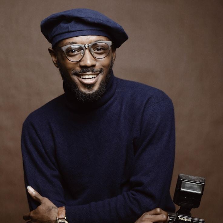 Aarav Singh, Lead Design Curator at TidalCanvasMurmur, reviewing corporate floral arrangements